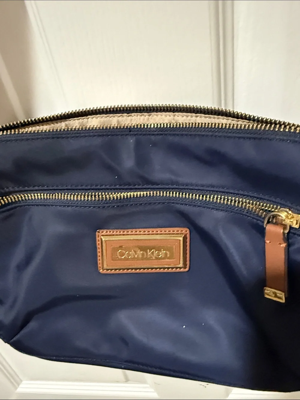 Calvin Klein Navy Crossbody with Tan water resistant Trim
